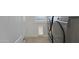 Convenient laundry area featuring modern washer and dryer with tile flooring and natural light at 4417 N 156Th Dr, Goodyear, AZ 85395