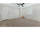 Inviting living room with tiled flooring, ceiling fan and neutral walls at 4417 N 156Th Dr, Goodyear, AZ 85395