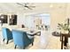 Bright living room featuring tile floors, modern ceiling fan, and open concept floor plan at 4417 N 156Th Dr, Goodyear, AZ 85395