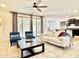 Comfortable living room with stylish furnishings, a ceiling fan, and sliding glass doors that bring in natural light at 4417 N 156Th Dr, Goodyear, AZ 85395