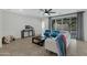 Bright living room with tile flooring, modern furnishings, and sliding glass doors to the yard at 4417 N 156Th Dr, Goodyear, AZ 85395