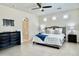 Spacious main bedroom with ensuite bathroom, ceiling fan, and wall-mounted TV mount at 4417 N 156Th Dr, Goodyear, AZ 85395