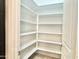 Walk-in pantry features ample shelving for organized storage at 4417 N 156Th Dr, Goodyear, AZ 85395