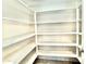 Walk-in pantry providing ample shelving and storage space for kitchen essentials at 4417 N 156Th Dr, Goodyear, AZ 85395