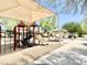 Community playground with shade structure and play equipment for enjoyment at 4417 N 156Th Dr, Goodyear, AZ 85395
