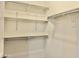 Bright walk-in closet featuring shelving for storage at 4417 N 156Th Dr, Goodyear, AZ 85395