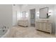Bright bathroom featuring double vanities, tile floor, and separate tub at 4901 E Lafayette Blvd, Phoenix, AZ 85018