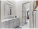 Bathroom featuring marble countertops, white cabinetry, and an open doorway to a bedroom at 4901 E Lafayette Blvd, Phoenix, AZ 85018