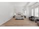 Bright bedroom featuring large windows with plantation shutters and hardwood floors at 4901 E Lafayette Blvd, Phoenix, AZ 85018