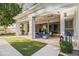 Large covered patio with an outdoor living space, built-in grill, and artificial turf at 4901 E Lafayette Blvd, Phoenix, AZ 85018