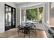 Cozy dining area with backyard views and modern accents at 4901 E Lafayette Blvd, Phoenix, AZ 85018