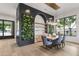 Open concept dining room featuring a decorative wall with shelving and plants at 4901 E Lafayette Blvd, Phoenix, AZ 85018