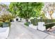 Long private driveway leading to a beautiful home with mature trees and landscaping at 4901 E Lafayette Blvd, Phoenix, AZ 85018