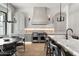Bright, eat-in kitchen with marble countertops, Wolf appliances, and modern light fixtures at 4901 E Lafayette Blvd, Phoenix, AZ 85018