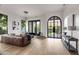Bright and open living room with dark frame windows and doors and modern furnishings at 4901 E Lafayette Blvd, Phoenix, AZ 85018