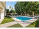 Sparkling backyard pool with manicured artificial lawn, palm trees and lounge chairs at 4901 E Lafayette Blvd, Phoenix, AZ 85018