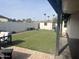 Large backyard featuring green space and outdoor seating area at 5537 E Drummer Ave, Mesa, AZ 85206