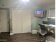 Bedroom with hardwood floors, closet, and modern desk setup at 5537 E Drummer Ave, Mesa, AZ 85206