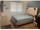 Bedroom showcasing modern headboard and neutral color palette at 5537 E Drummer Ave, Mesa, AZ 85206
