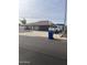 Single story home with a 2 car garage, a basketball hoop on the driveway and desert landscaping at 5537 E Drummer Ave, Mesa, AZ 85206