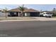 Charming single-story home features stone accents, well-maintained landscaping, and a convenient two-car garage at 5537 E Drummer Ave, Mesa, AZ 85206