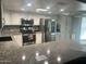 Updated kitchen featuring granite counters, stainless steel appliances and white cabinets at 5537 E Drummer Ave, Mesa, AZ 85206
