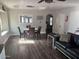 Comfortable living and dining space with updated furniture and wood flooring at 5537 E Drummer Ave, Mesa, AZ 85206