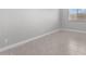 Bright bedroom featuring neutral tile and a large window at 5619 N 193Rd Ave, Litchfield Park, AZ 85340