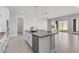Modern kitchen island featuring granite countertops and stainless steel appliances at 5619 N 193Rd Ave, Litchfield Park, AZ 85340