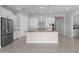 Modern kitchen with stainless steel appliances, granite countertops, and a center island at 5619 N 193Rd Ave, Litchfield Park, AZ 85340
