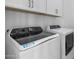 Modern laundry room with new washer and dryer at 5619 N 193Rd Ave, Litchfield Park, AZ 85340