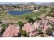 Beautiful aerial view overlooking the homes in a lakeside community with a lush golf course at 5959 W Lone Cactus Dr, Glendale, AZ 85308