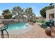 Lush backyard has a large patio and a swimming pool with a waterfall feature at 5959 W Lone Cactus Dr, Glendale, AZ 85308