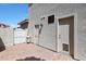 Exterior view of the home with a patio, exterior doors and a gate at 5959 W Lone Cactus Dr, Glendale, AZ 85308