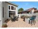 Outdoor space features a covered patio, a built-in grill, and ample seating for entertaining at 5959 W Lone Cactus Dr, Glendale, AZ 85308