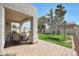Covered patio offers ample seating and entertaining space with lush greenery at 5959 W Lone Cactus Dr, Glendale, AZ 85308
