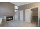 Bathroom showcasing a fireplace, shower, and separate door to a large walk-in closet at 5959 W Lone Cactus Dr, Glendale, AZ 85308