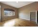 Bedroom with wood floors and window with neighborhood view at 5959 W Lone Cactus Dr, Glendale, AZ 85308