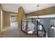 Second-floor hallway has dark green accent wall and view of entryway at 5959 W Lone Cactus Dr, Glendale, AZ 85308