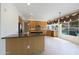Bright kitchen with stainless steel appliances, an island, tile flooring, and a view to the pool in the back yard at 5959 W Lone Cactus Dr, Glendale, AZ 85308