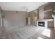 Bright living room showcases a cozy fireplace, carpet, and neutral colors at 5959 W Lone Cactus Dr, Glendale, AZ 85308