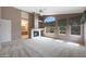 Spacious living room with fireplace, carpet, and plenty of natural light at 5959 W Lone Cactus Dr, Glendale, AZ 85308