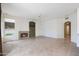 Cozy living room with fireplace, built-in shelving, and natural light at 5959 W Lone Cactus Dr, Glendale, AZ 85308