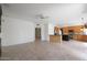 Expansive living area with tile flooring, and an open layout to the kitchen at 5959 W Lone Cactus Dr, Glendale, AZ 85308