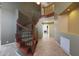 Elegant curved staircase with wood and wrought iron details at 5959 W Lone Cactus Dr, Glendale, AZ 85308