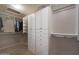 This walk-in closet has custom shelving and organization system at 5959 W Lone Cactus Dr, Glendale, AZ 85308