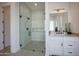 Bathroom featuring a frameless walk-in shower, vanity with storage and accent mirror at 6108 E Shasta Daisy Ln, Prescott Valley, AZ 86315