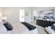Spacious bedroom with plush bed, modern dresser, and views leading to the en suite bathroom at 6108 E Shasta Daisy Ln, Prescott Valley, AZ 86315