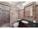 Classic bathroom with a custom vanity, tiled walk-in shower, and tile accents at 630 S Boulder Ct, Gilbert, AZ 85296