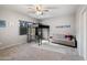 Well-lit bedroom featuring carpet, a ceiling fan, a loft bed, and a comfortable seating area, offering a versatile space at 630 S Boulder Ct, Gilbert, AZ 85296